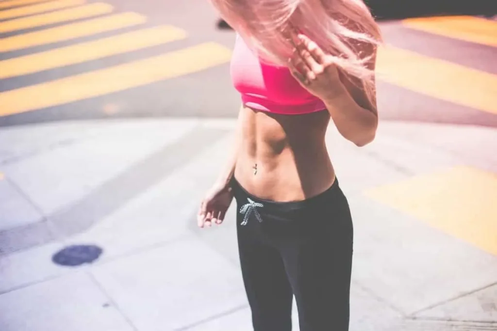 Woman with toned stomach after LA-EMS Body Sculpting Treatment Sparkhill